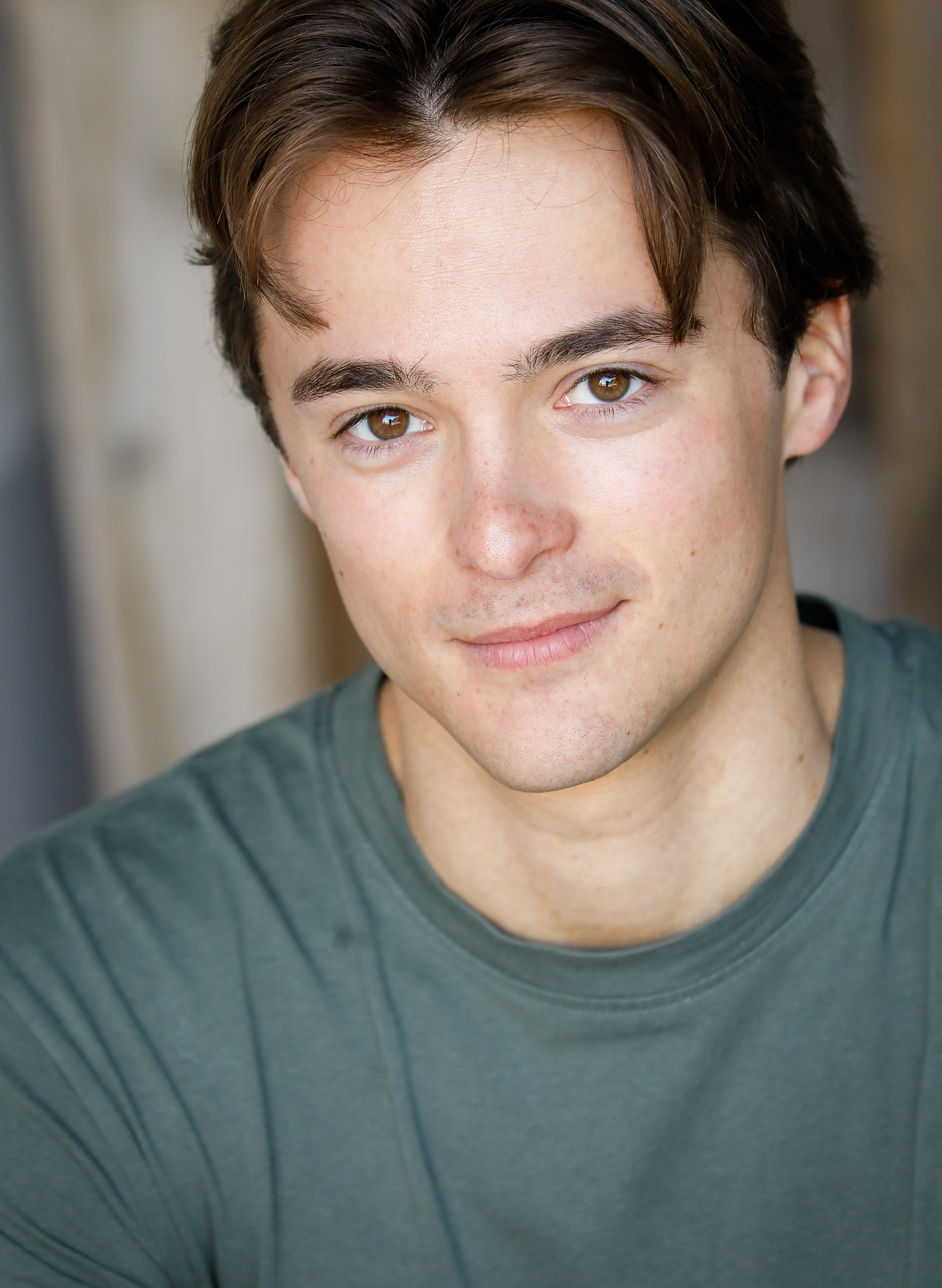 Leonardo Cecchi headshot with subtle smile in teal t-shirt